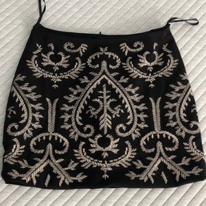 Black mini skirt with gold stitching